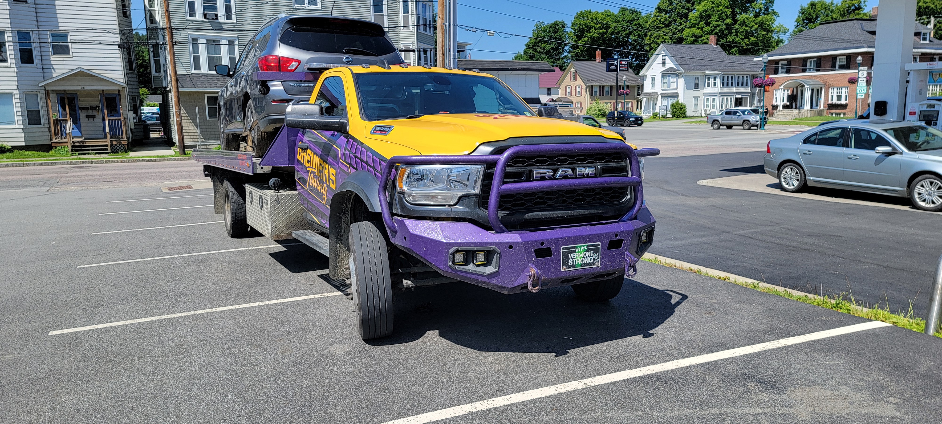 Flatbed Tow Truck Transporting SUV