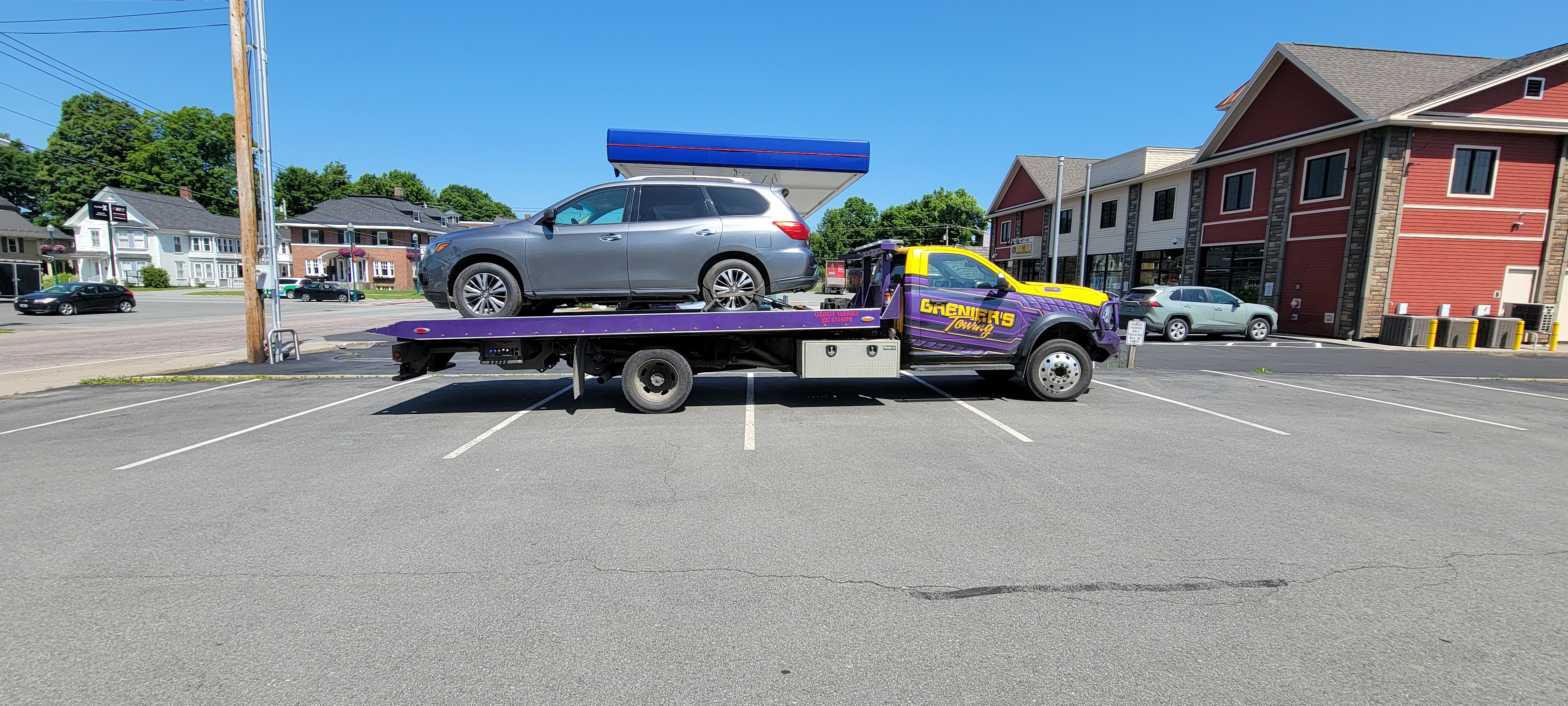 Flatbed Truck Towing SUV